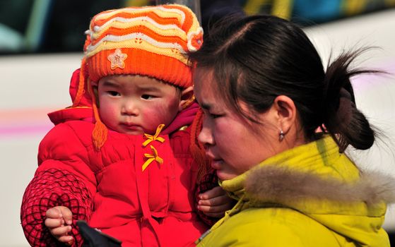 portrait of Chinese mother with her baby