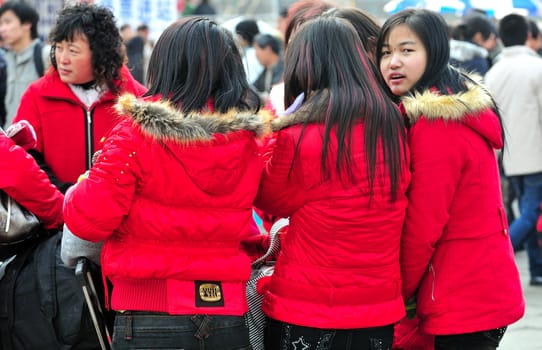 Group of Chinese girls in crowded shanghai street