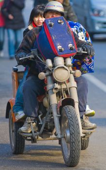 Chinese motorcyclist in shanghai street