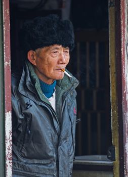 Portrait of old Chinese man in Shanghai China