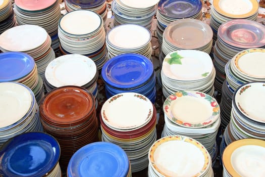 stacks of colorful plates in different designs
