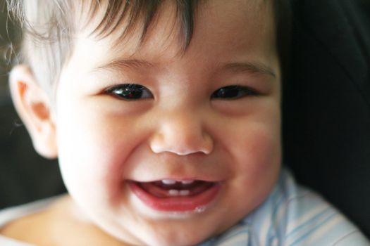 Baby boy with charming smile. part Scandinavian,Thai background