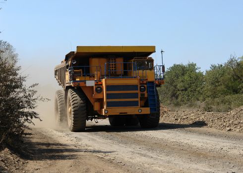 The big lorry goes on road and carries cargo