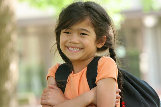 Adorable five year old girl ready for first day of school;