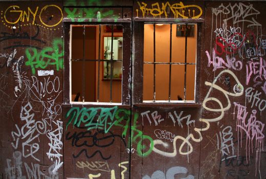 graffiti painted door, grunge style, urban background
