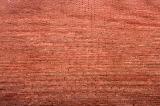 background or pattern of a big red orange brick wall