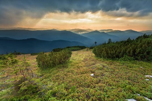 Beautiful sunset in the mountains with dramatic sky