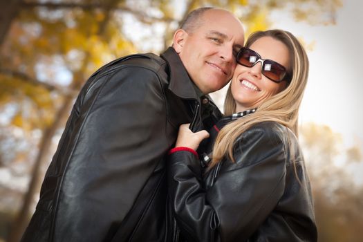 Happy, Attractive Couple in Park with Leather Jackets.