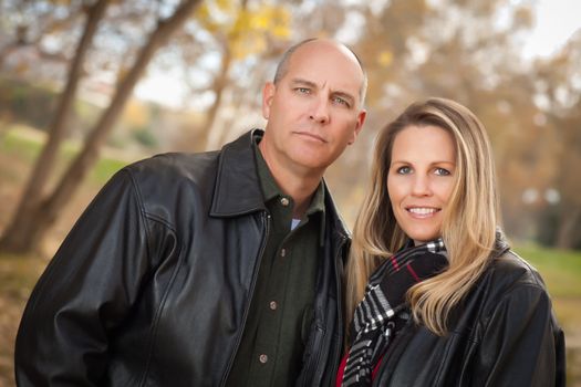 Happy, Attractive Couple in Park with Leather Jackets.