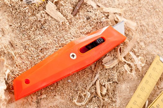 tools series: sharp knife on wooden sawdust