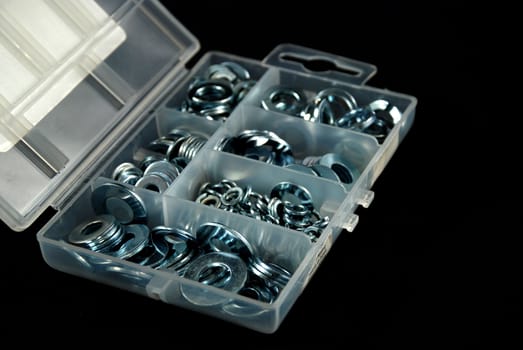 box containing several nuts and washers of different sizes