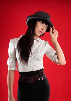 Beautiful mixed race young woman wearing smart clothing and a black  hat