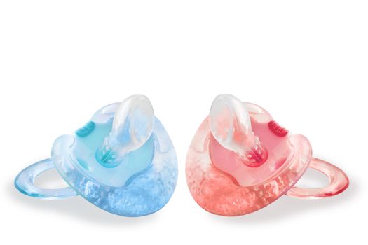 Pink and blue baby pacifiers with cold gel and teething ridges, isolated on white backgroud