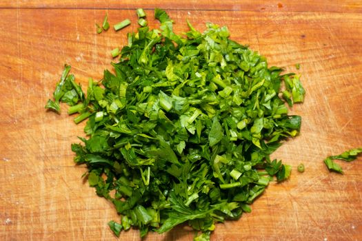 Green parsley on a wood board