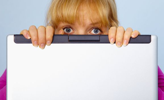 Frightened, the woman was guilty and hides behind a computer screen