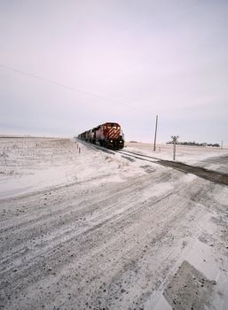 Diesel engine approaching road crossing in winter