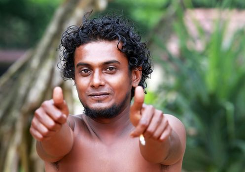 Portrait young men on a green background. Sri Lanka