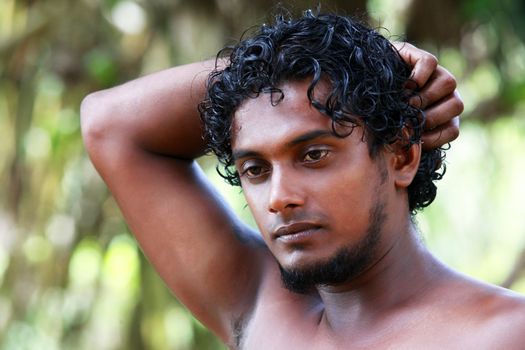 Portrait young men on a green background. Sri Lanka