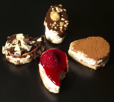 Composition of creative yogurt desserts topped with a variety of flavors