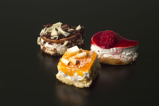 Composition of creative yogurt desserts topped with a variety of flavors