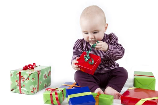 young child unpacking presents. white background