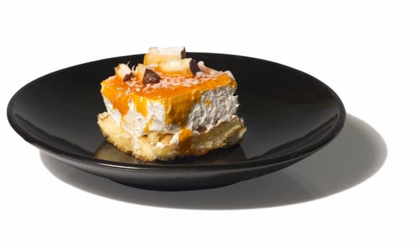 Creative yogurt dessert on a black plate