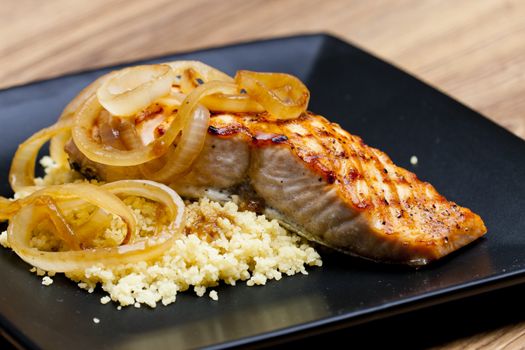 grilled salmon with burned onion and couscous