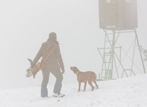 woman with her dog at hunt