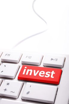 invest or investment key or button in red showing business success