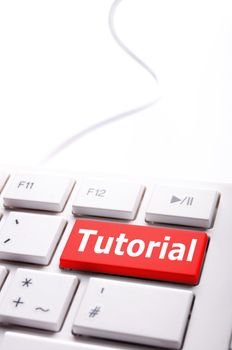 tutorial or e learning concept with key on computer keyboard