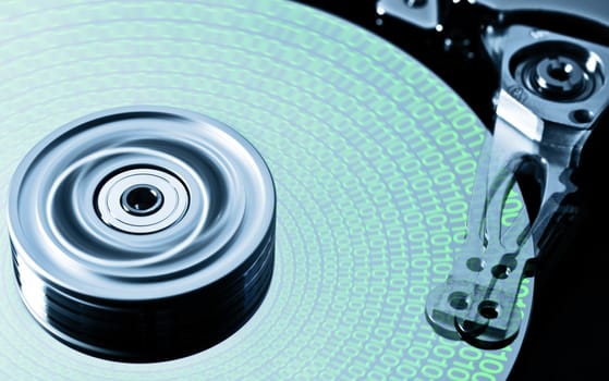 hard disk drive in motion with green data