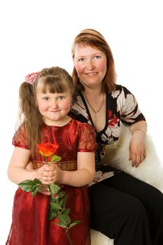 Mother with daughter sitting on chair isolated on white