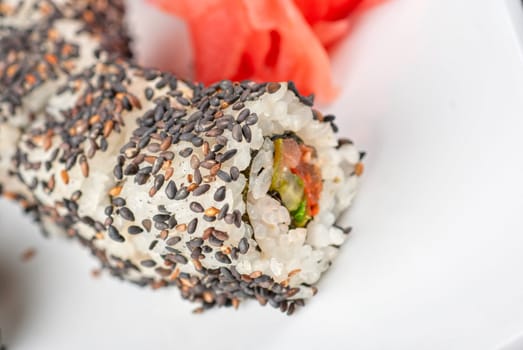 Closeup of Sushi rolls at plate with sesame