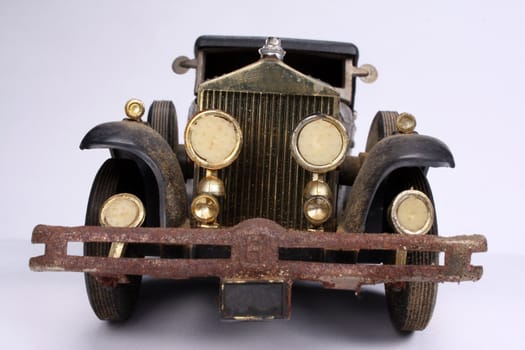 A small replica model of a vintage car.