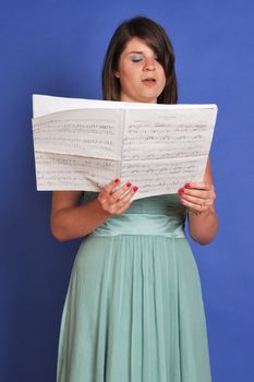 choir girl singing from sheet music