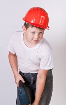 Portrait of a boy in a red protective helmet