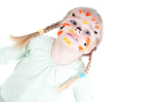 Studio shot of little girl playing with colors