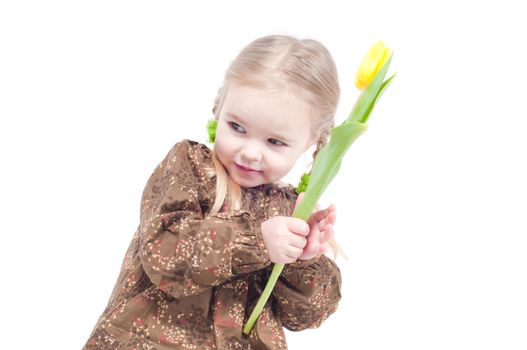 Studio shot of little girl with flowers