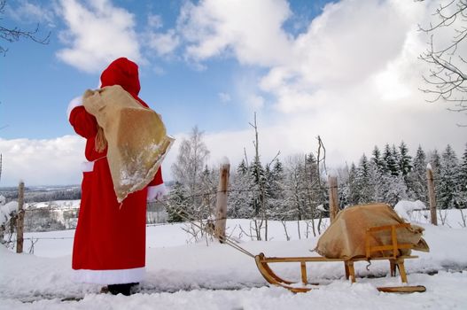 Santa Claus, Father Christmas in a beautiful winter landscape