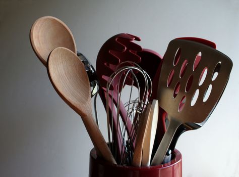 A bucket of cooking utensils.