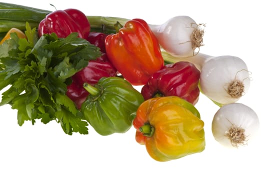 some small exotic peppers on white background