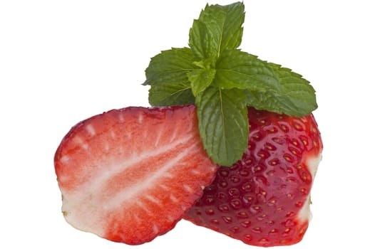 halved strawberry and mint leaves on white background