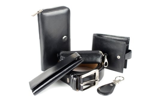 Leather male bag with accessories on a white