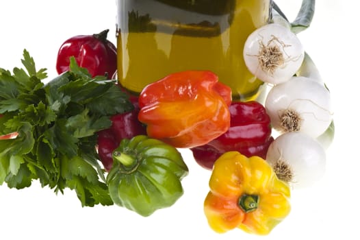 some small exotic peppers on white background
