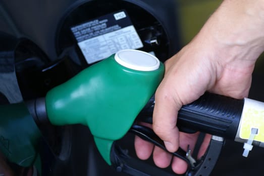 Man filling up his gas tank.