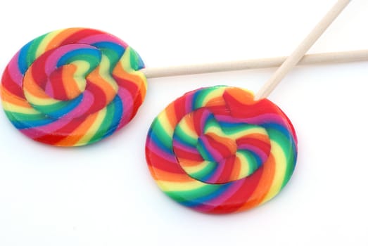 Two sweet large colorful lollypops.