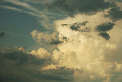 The image of white clouds on a background of the dark blue sky