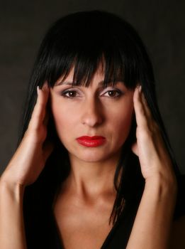 Portrait of the beautiful brunette in studio