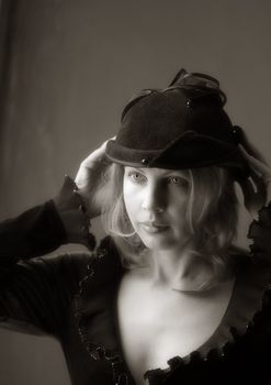 Portrait of the woman in a hat in style of a retro