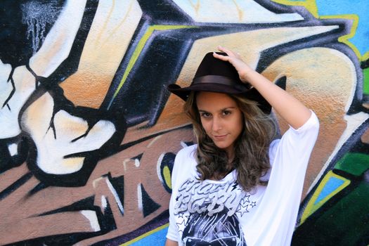 cowboy fashion girl in graffiti background